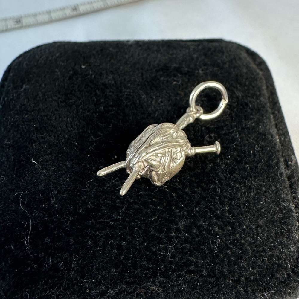Small silver yarn ball and needles charm for bracelet